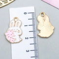 White enamel bunny pendant holding a pink carrot for DIY jewelry and keychains - Pink Enamel Rabbit