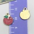 Detail of apple alloy charms with red enamel and gold back showing 2cm size on ruler - Apple Style (24419)