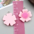 Pink resin flower charm with dark pink textured core and silver metal jump ring detail - Sunflower Style (24337)