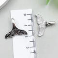 Silver whale tail pendants with intricate tribal patterns and smooth finish - Ocean Fish Tail Shape (22303)