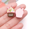 Close-up of resin cupcake charm with rainbow frosting and silver loop for DIY jewelry - Pink Base Coffee Brown Sweet Milkshake Cake (24528)