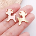 Macro detail of pink enamel deer charms showing polished gold finish and textured back - Pink Christmas Reindeer Style