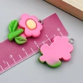 Pink resin flower pendant with green leaves and metal loop measured by ruler - Plumeria with Green Leaves (24341) / Rose Red