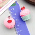 Detailed view of pink and green resin cupcake charms with heart tops and metal rings - Pink Heart Cupcake (24090)