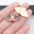 Detail of pink moth butterfly pendant with moon patterns and gold sunburst texture - Rose Red Butterfly (18694)