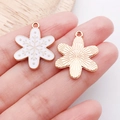 Golden snowflake charm with white enamel detail for DIY jewelry making and bracelets - White Christmas Snowflake Style