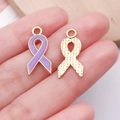 Handheld display of purple enamel ribbon charm with golden textured back detail - Small Purple Bowknot Ribbon Charm (24870)