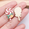 Lollipop-shaped alloy charm with red and white enamel spiral and a green bow detail - Red Bow Bell Lollipop (25291)