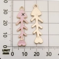 Detailed macro view of 33mm pink enamel fishbone alloy pendant with measurement scale - Pink Fish Bone
