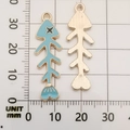 Detail showing 33mm fish bone alloy charms with light blue enamel and metal texture - Blue Fish Bone