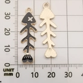 Golden fish bone alloy pendant with black enamel finish, size 35x12mm, front and back view - Black Fish Bone