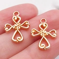 Close-up of small rose gold hollow cross charms for DIY jewelry and bracelet making - 1pc Heart Splicing Cross 19x14mm (20326)