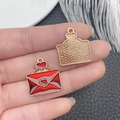 Macro shot of red enamel envelope charm with golden mesh texture and heart detail - Red Glitter Enamel Zinc Alloy Heart Envelope Charm (21469)