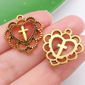 Detail view of retro gold cross heart charms with textured and smooth finishes - Hollow Heart Cross Style (20366)