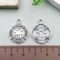 Vintage silver alloy fire department cross charm pendant showing front and back detail - Fire Dept Badge Style (21415)