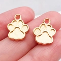 Two golden paw print pendants with vertical striped details for DIY jewelry making - Double-Sided Dog Paw Charm (18328)
