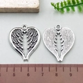 Antique silver punk style heart wing pendant with detailed vintage feather texture - Large Heart Wing (10397)