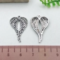 Silver alloy wing pendant charms with detailed feather texture for DIY jewelry making - Medium Heart Wing (21421)