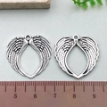Silver alloy angel wing heart pendant for DIY jewelry with vintage feather texture details - Feathered Heart Wing (21423)