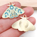 Green and blue enamel moth charm with gold plating and radial star pattern back - Patterned Butterfly Style (18691)