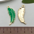 DIY feather charms in green enamel alloy with golden back for jewelry making - Green Feather