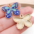 Blue butterfly enamel pendant with gold metal edges for DIY jewelry and necklaces - Patterned Butterfly Style (19023)