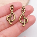 Antique bronze treble clef music charms for DIY jewelry making on fingertips - Treble Clef (10891)