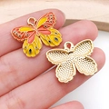 Macro detail of a colorful butterfly pendant made of gold alloy and enamel for DIY jewelry - Patterned Butterfly Style (19025)