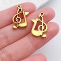 Detaillierte Nahaufnahme goldener Violinschlüssel und Musiknoten Anhänger für DIY Schmuck - G-Clef Zirkulärer Stil