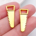 Pair of golden saw blade alloy charms for DIY necklaces and earring accessories - Saw 23x9mm (20385)