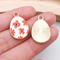 Easter egg pendant with white enamel and orange floral pattern on golden base - Flower Pattern Egg (15141)