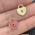 Pink glitter and textured gold heart lock pendants displayed on palm for sizing - Pink Glitter Heart Lock (21465) / 13x11mm