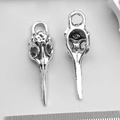 Silver bird skull totem charms for DIY jewelry making shown with a measuring ruler - Skull Bird Head 12x40mm(4851)