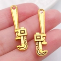Miniature pipe wrench alloy pendant in golden finish for DIY jewelry and keychain - Tool 32x8mm (20397)