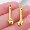 Golden alloy wrench charm pendant for DIY jewelry making and keychain accessories - Wrench 23x6mm (20398)