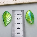 Iridescent green acrylic leaf pendants for DIY jewelry making shown with a ruler - Osmanthus Leaf Style (21951) / 1 Piece (34x19mm) / Iridescent Light Green