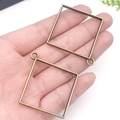 Square bronze metal bezel pendant charm for DIY jewelry making shown in hand - Large Ancient Bronze Square Frame (13512)