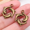 Paire de pendentifs dauphins en bronze antique pour création de colliers et bracelets DIY - Style Dauphin en Cercle (20728)
