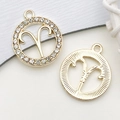 Golden Aries zodiac charm with white rhinestones and a textured metal back finish - Aries Zodiac (18607) / Rhinestone Zodiac