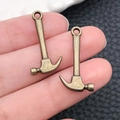Set of two vintage bronze alloy hammer pendants for DIY jewelry and keychain making - Antique Bronze Hammer (17388)