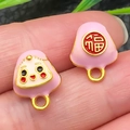Pink enamel Zongzi charm with Fu character and cute face on golden metal base - Pink Large Smile Zongzi (22599)