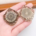 Detailed macro view of vintage bronze clock gear pendants for steampunk jewelry DIY projects - Antique Large Clock Gear (8906)