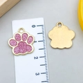 Colgante huella de gato con purpurina rosa y marco dorado para creación de joyería - Huella de Animal KC Dorada con Brillo Rosa (23327)