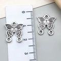 Vintage silver butterfly charm with hollow carved wings and triple loop connectors - Double Loop Butterfly Style (22317) / 16x14mm