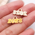 Pendentifs année 2028 en alliage doré avec émail jaune et relief pour bijoux DIY - Jaune 2028