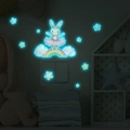 Luminous wall sticker set showing a glowing ballet rabbit and rainbow in a dark kids room - Blue Glow / 13*13cm
