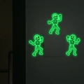 Glow-in-the-dark Halloween skeleton stickers applied around a white light switch - Luminous Green (MG-YK012)