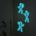 Luminous Halloween skeleton wall stickers glowing bright blue on a dark indoor wall - Luminous Blue (MG-YK012)