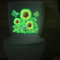 Adesivi luminescenti con girasoli e farfalle su una superficie bianca piana - Stile Luce Verde