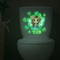 Adesivo murale luminoso con fata e farfalle che brillano di verde sul serbatoio della toilette - Verde